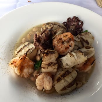 Torino Restaurants - Grilled Seafood over Spinach and white beans. - Italian Near Me - Metuchen, New Jersey Torino Restaurants - Grilled Seafood over Spinach and white beans. - Italian Near Me - Metuchen, New Jersey