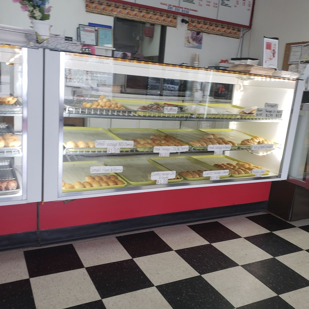Top Donuts - a bakery with a checkered floor - Donuts Near Me - Spring, Texas