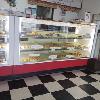 Top Donuts - a bakery with a checkered floor - Donuts Near Me - Spring, Texas