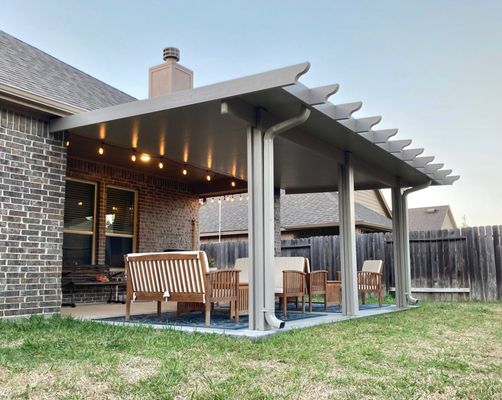 Insulated Aluminum Patio Cover - Adobe color aluminum with deep wood grain finish wrap with rafter tails.