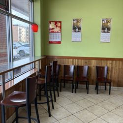 Happy Chef - Inside . High top counter seating and chairs for customers waiting