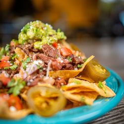 El Capricho Restaurant - Asada nachos with toppings