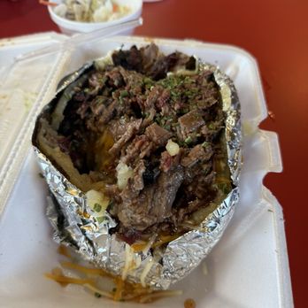 Smokin’ Dick’s Barbecue - Brisket stuffed bake potato - Barbeque Near Me - Post, Texas