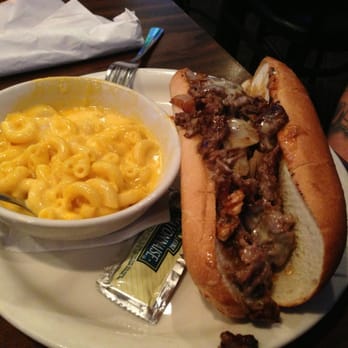 Friendly Confines - Philly Cheesesteak w/ a side of Mac & Cheese - Sports Bars Near Me - Lake Mary, Florida Friendly Confines - Philly Cheesesteak w/ a side of Mac & Cheese - Sports Bars Near Me - Lake Mary, Florida