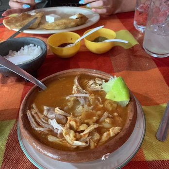 Salus y Chemos - Pozole Rojo..( Mexican Hominy stew with pork) they bring some chili powder, oregano, onion & lime - Mexican Near Me - Cancún, ROO Salus y Chemos - Pozole Rojo..( Mexican Hominy stew with pork) they bring some chili powder, oregano, onion & lime - Mexican Near Me - Cancún, ROO
