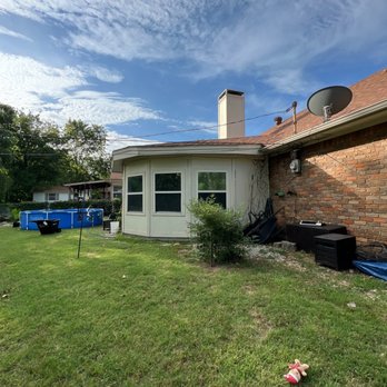 FVG Solutions - Before - no gutters was causing flooded pathways during rain. - Damage Restoration Near Me - Carrollton, Texas