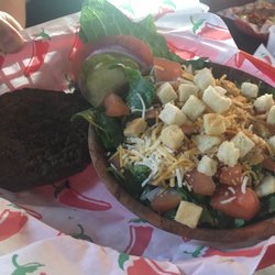 Frosty's Bar & Grill - Salad with burger patty.
