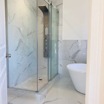 Laari Adda - a bathroom with a bathtub and a walk in shower - Pakistani Near Me - Mississauga, Ontario