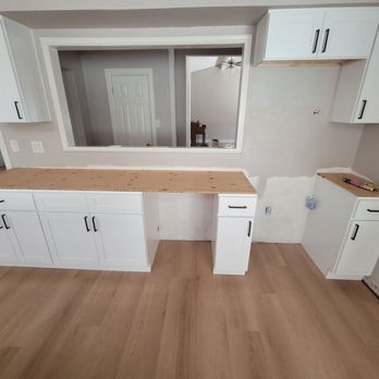 Rapid Response Restoration - Replace floor, baseboard, cabinet and countertop - Damage Restoration Near Me