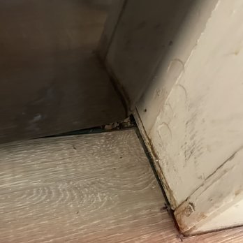 Bay State Bath - Poor cut to the flooring (and not GRAY WHITE flooring I gave sample of).  Didn't continue flooring under the washer - Kitchen & Bath Near Me - Pembroke, Massachusetts