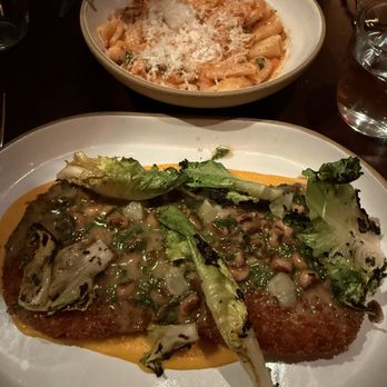 Lowland Tavern - Pork schnitzel - 10/10 Rigatoni in the back - New American Near Me - Charleston, South Carolina Lowland Tavern - Pork schnitzel - 10/10 Rigatoni in the back - New American Near Me - Charleston, South Carolina