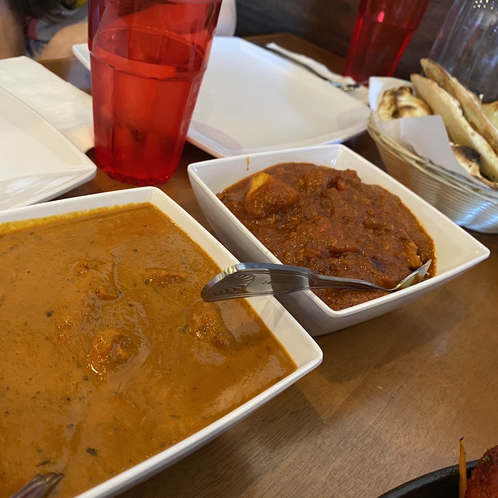 Biryani Pot, Indian Restaurant - Butter chicken on left. Chicken vindaloo on right. Butter naan in far back. - Indian Near Me - Chandler, Arizona Biryani Pot, Indian Restaurant - Butter chicken on left. Chicken vindaloo on right. Butter naan in far back. - Indian Near Me - Chandler, Arizona