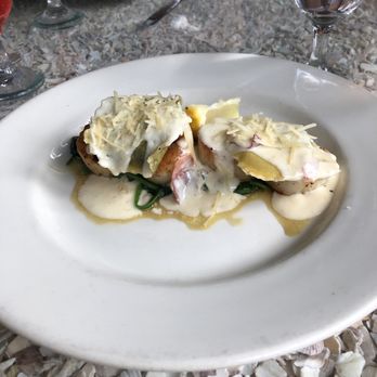 Catch 22 - Early bird special  Three scallops topped by three mushroom cheese ravioli  with sautéed spinach 3/5 - Seafood Near Me - Hilton Head Island, South Carolina
