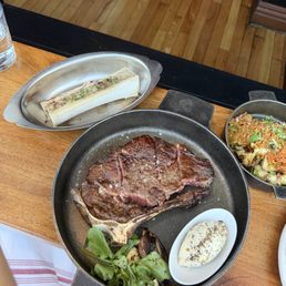 New York strip, bone marrow, and artichoke New York strip, bone marrow, and artichoke