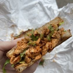 Harmony Plant Fare - Vegan Buffalo chicken sandwich made with soy curls