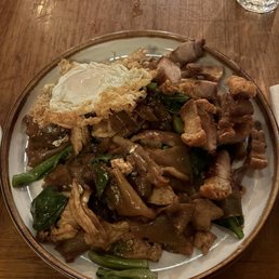 Pad see ew with fried egg and roasted pork