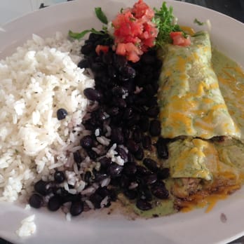 Wahoo's Fish Taco - #1 with one chicken enchilada smothered with green sauce with a side of white  rice and black beans - $5.91 - Mexican Near Me - Costa Mesa, California