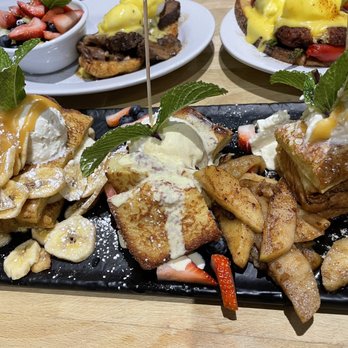 Green Eggs Cafe - a plate of waffles with bananas and strawberries - Breakfast & Brunch Near Me - Philadelphia, Pennsylvania Green Eggs Cafe - a plate of waffles with bananas and strawberries - Breakfast & Brunch Near Me - Philadelphia, Pennsylvania