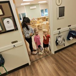 Woods Montessori School - Daughter and her teacher sharing a joyful moment with eschitthrt.