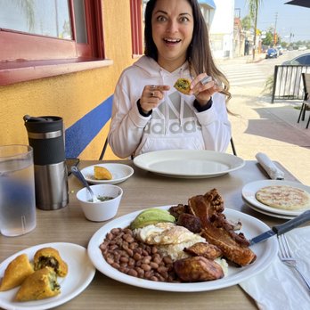 La Maria - Bandeja Paisa, Empanadas y Cheese Arepa... And one very happy girl! - Colombian Near Me - North Hollywood, California La Maria - Bandeja Paisa, Empanadas y Cheese Arepa... And one very happy girl! - Colombian Near Me - North Hollywood, California