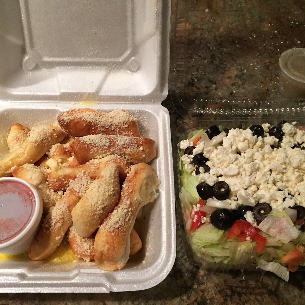 Locri Pizzeria - Breadstix and Greek salad - Pizza Near Me - Davisburg, Michigan Locri Pizzeria - Breadstix and Greek salad - Pizza Near Me - Davisburg, Michigan