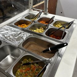 Tacos Jimenez - Breakfast Hot bar with a variety of eggs for breakfast burritos or tacos