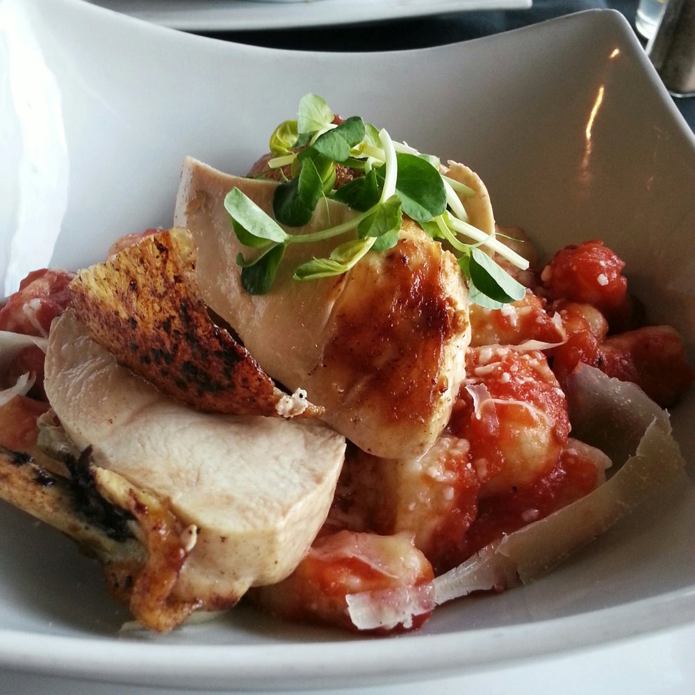 Sweet Onion Bistro - Pan roasted chicken served on gnocchi with a tomato and basil sauce - Breakfast & Brunch Near Me - London, Ontario Sweet Onion Bistro - Pan roasted chicken served on gnocchi with a tomato and basil sauce - Breakfast & Brunch Near Me - London, Ontario