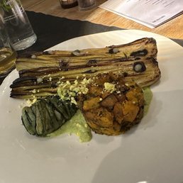 Roasted leek with zucchini sauce, roasted black garlic, and pumpkin