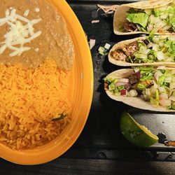 Corona's  Authentic Mexican Restaurant - Pork street tacos  and rice and beans.