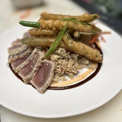 Bella Fresca - Sesame Tuna Appetizer served on a bed of fried rice & topped with freshly fried green beans.