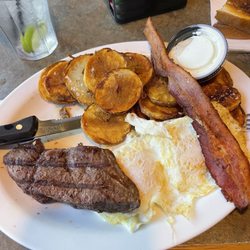 Good Time Charlie's - Steak and eggs with Charlie's chips. The bacon is from my breakfast!