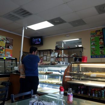 Sabor Valluno - a man standing in front of the counter - Bakeries Near Me - Kissimmee, Florida Sabor Valluno - a man standing in front of the counter - Bakeries Near Me - Kissimmee, Florida