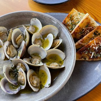 83 West - 12 local steamed clams that came in a white wine, butter, parsley, and garlic sauce. - Seafood Near Me - Cedar Key, Florida