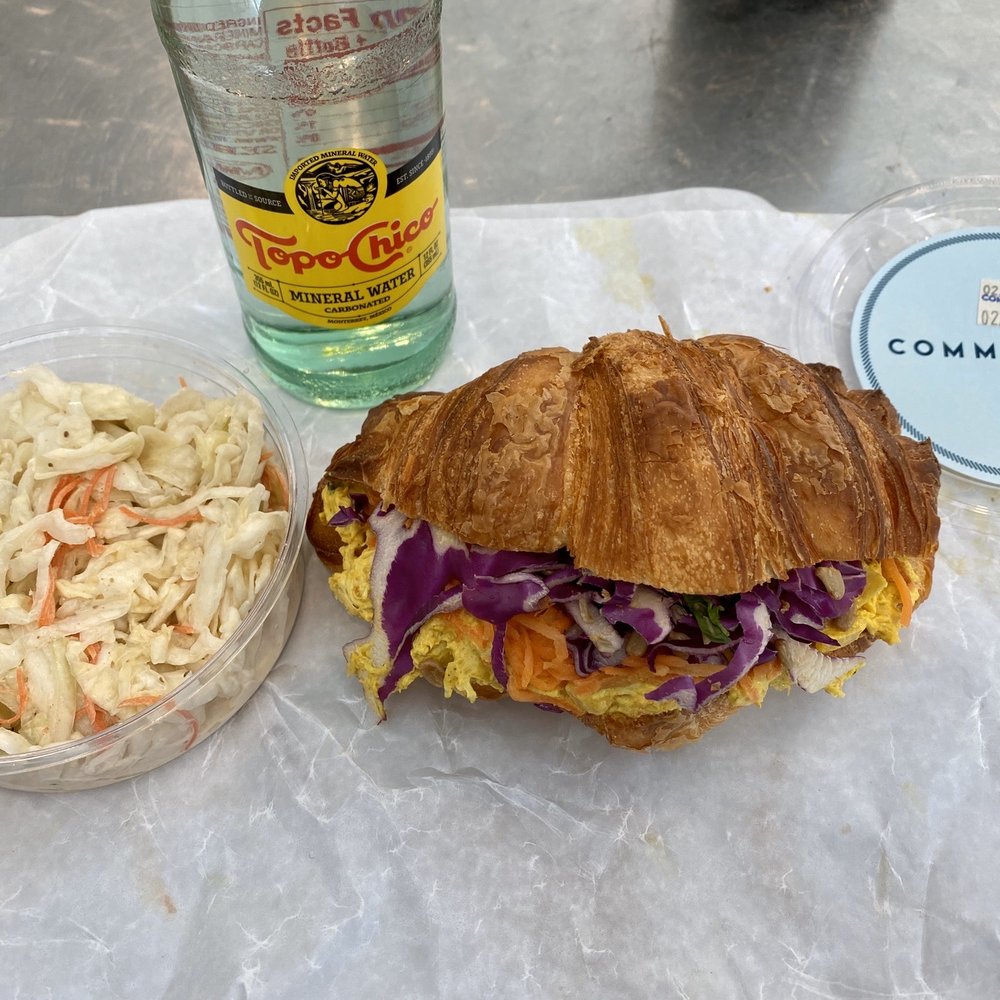 Commissary - Curry Chicken Salad Sandwich with a side of Coleslaw and a crispy Topo Chico Mineral Water. - Bakeries Near Me - Dallas, Texas