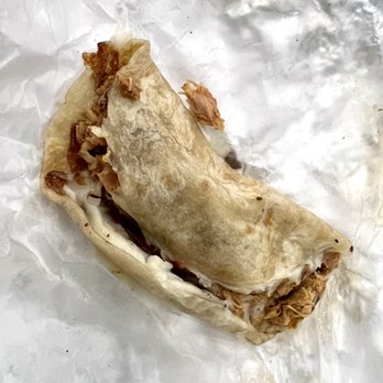 Tacos Regios El Coquis - a half eaten burrito - Food Trucks Near Me - Katy, Texas Tacos Regios El Coquis - a half eaten burrito - Food Trucks Near Me - Katy, Texas