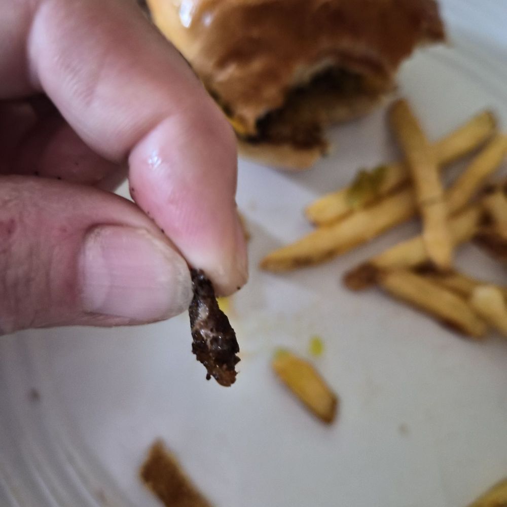 Jack Astor's - This is how thick my kids burger was. Cheese was thicker and it was burnt black. Garbage - Sports Bars Near Me - London, Ontario Jack Astor's - This is how thick my kids burger was. Cheese was thicker and it was burnt black. Garbage - Sports Bars Near Me - London, Ontario