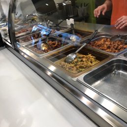 a woman serving food to a customer