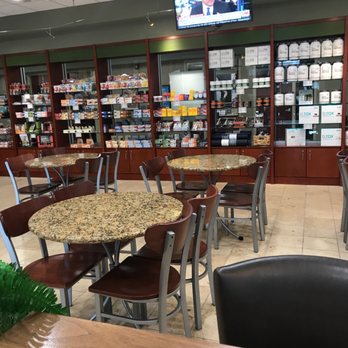 LifeCafe - the inside of a store with tables and chairs - Cafes Near Me - Cary, North Carolina