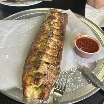 Giovanni’s Pizzeria - Stromboli with pepperoni, sausage, green pepper and onion. - Pizza Near Me - Winter Garden, Florida Giovanni’s Pizzeria - Stromboli with pepperoni, sausage, green pepper and onion. - Pizza Near Me - Winter Garden, Florida