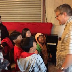 Pianos Wholesale - Piano Technician and Restorer John teaches the next generation of pianists from the "Piano Mom" group.