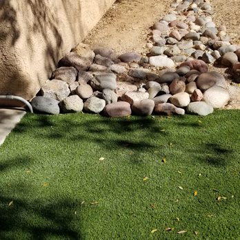 Arizona Turf Masters Tucson - rocks  not moved back to circle well for drainage - Landscaping Near Me - Tucson, Arizona
