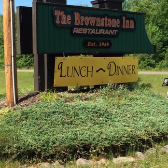 The Brownstone Inn - Signage out front on M-28 - American Near Me - Au Train, Michigan The Brownstone Inn - Signage out front on M-28 - American Near Me - Au Train, Michigan