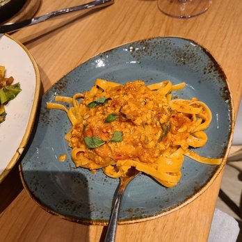 Kitchen Social - Split portion of the Chicken Bolognese. So flavorful! - New American Near Me - Dublin, Ohio