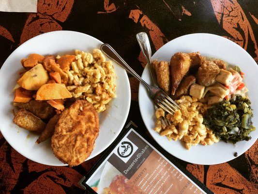 Photo of ELife Restaurant - Washington, DC, DC, US. (Left to right) Chikn fried chikn plate w/ mac n cheese & sweet potatoes. Double portion of maple curry drumsticks w/mac n cheese & collards