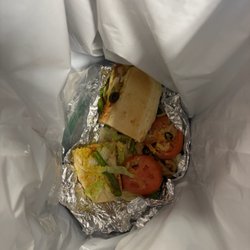The Eatery Deli & Sandwich Shopp - This completely wrongly made nasty sandwich in the trash without a single bite out of it.