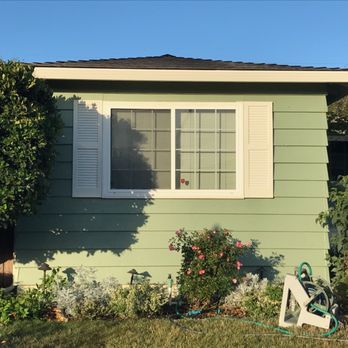 La Maison Construction - a green house with white shutters - General Contractors Near Me - Fremont, California