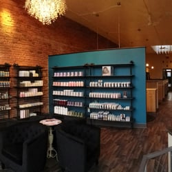 Bask Salon - Front waiting area, product shelves and glitter wall!