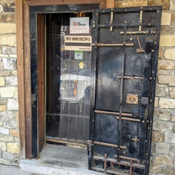 Safe House Saloon - A bank safe door is the entrance for the Safe House - Pizza Near Me - Lansing, Iowa