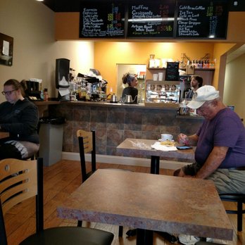 Richboro Coffee - a man sitting at a table in a coffee shop - Coffee & Tea Near Me - Richboro, Pennsylvania