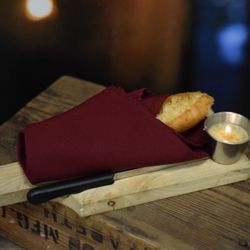 Pines Dinner Theatre - Fresh baked baguette with melted garlic herb butter
